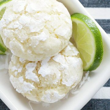 coconut key lime cookies overhead view on plate with lime slices