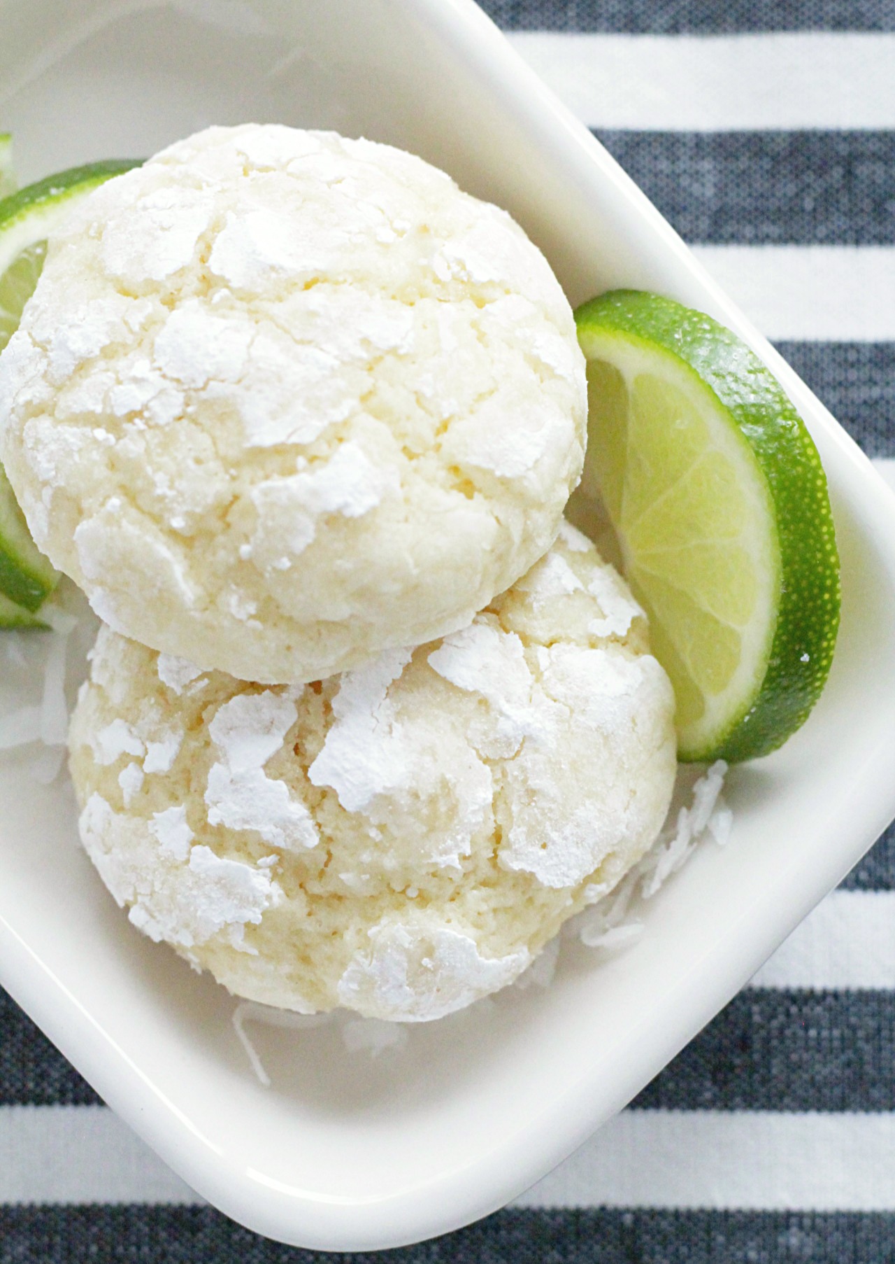 coconut key lime cookies overhead view on plate with lime slices