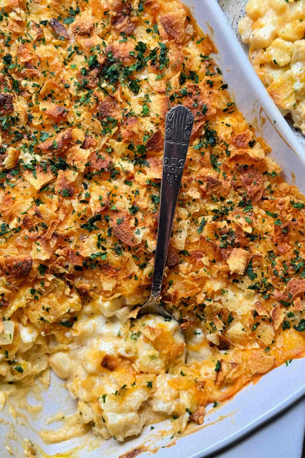 My easy cheesy potatoes casserole is a classic comfort food side dish. Tender diced potatoes in creamy sauce with a crunchy topping. via @foodtasticmom