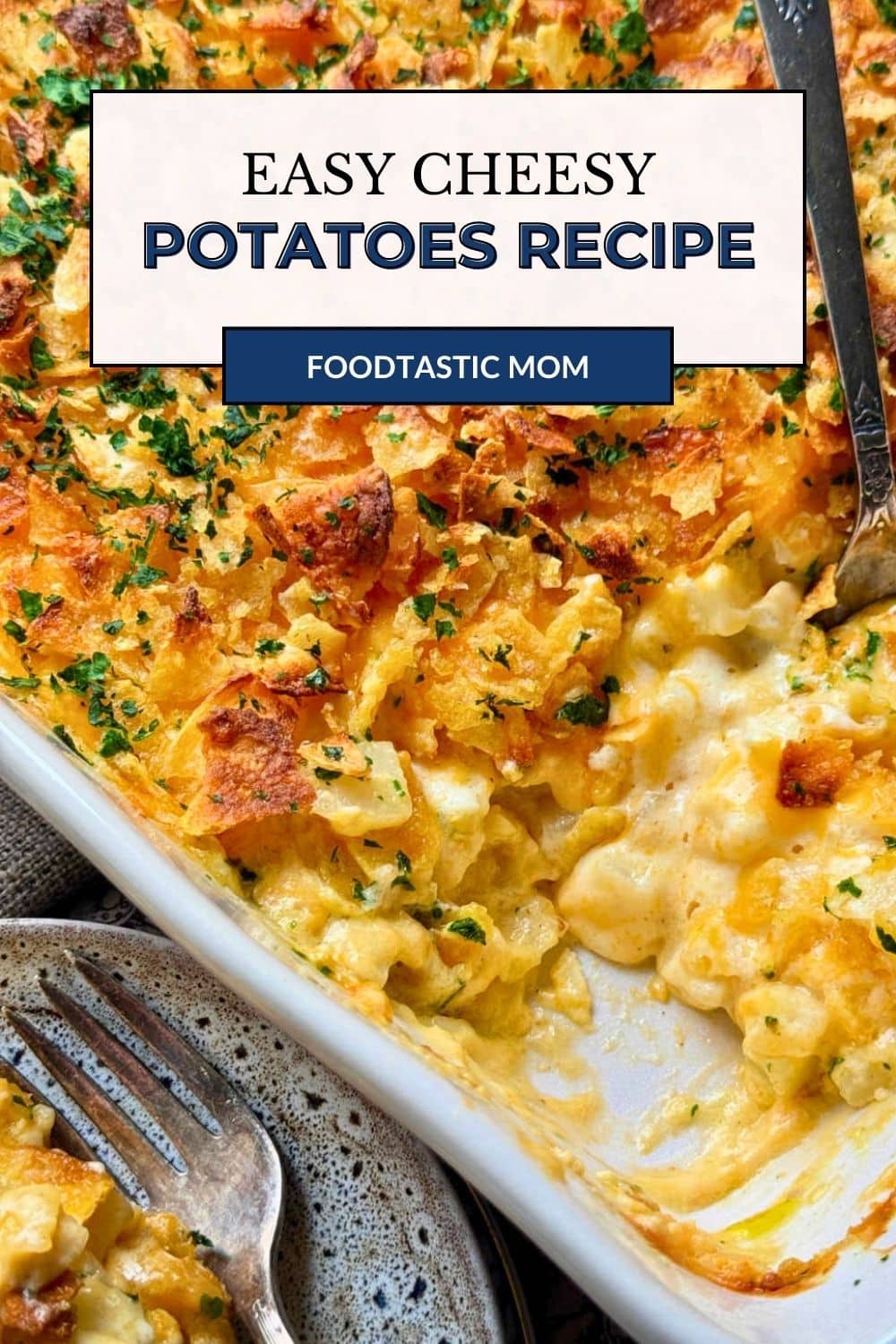 My easy cheesy potatoes casserole is a classic comfort food side dish. Tender diced potatoes in creamy sauce with a crunchy topping. via @foodtasticmom