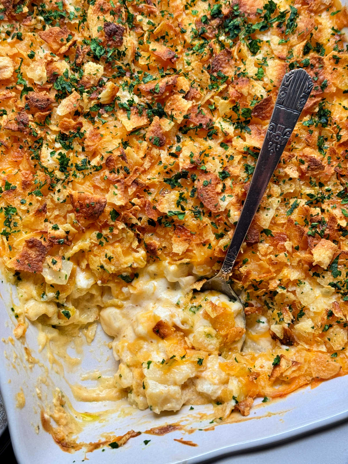 a casserole dish of cheesy potatoes ready to serve