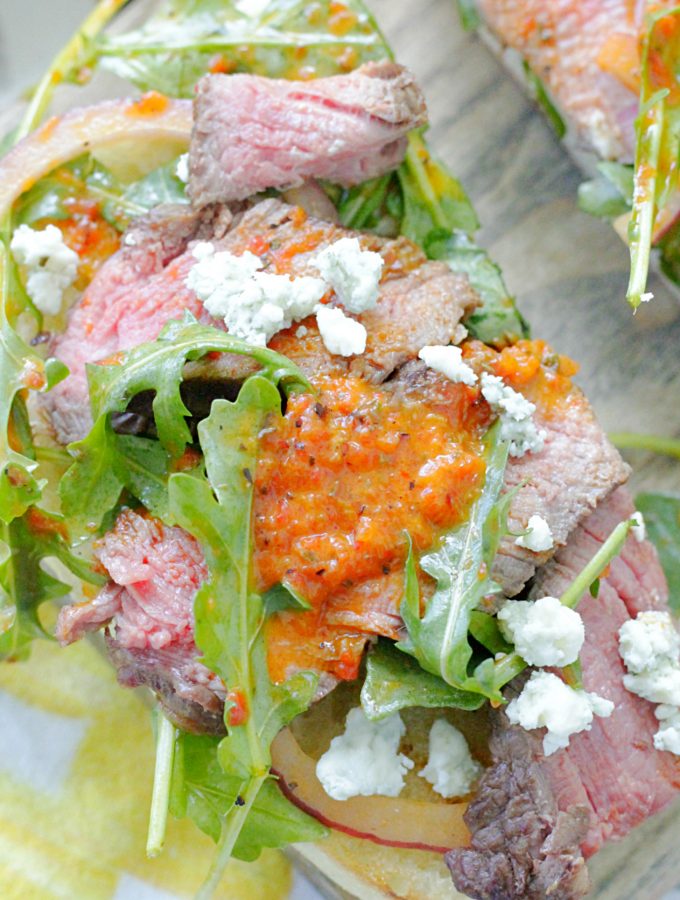 open face grilled steak sandwich top view close up