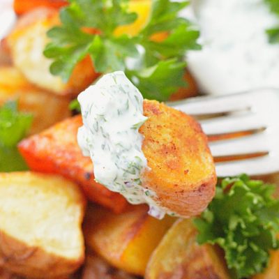 close up view of oven roasted potato on fork