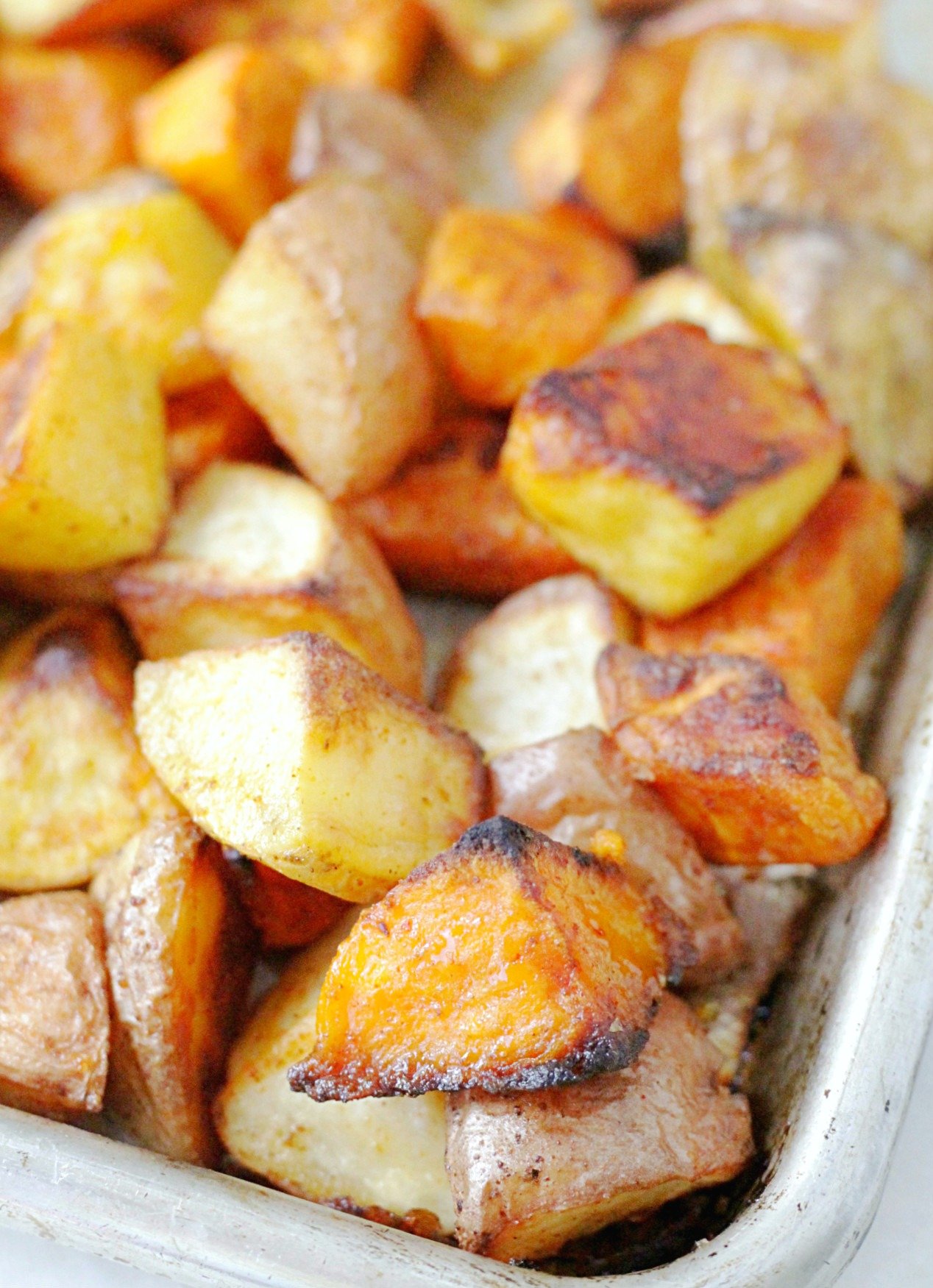 close up of perfect oven roasted potatoes on sheet pan