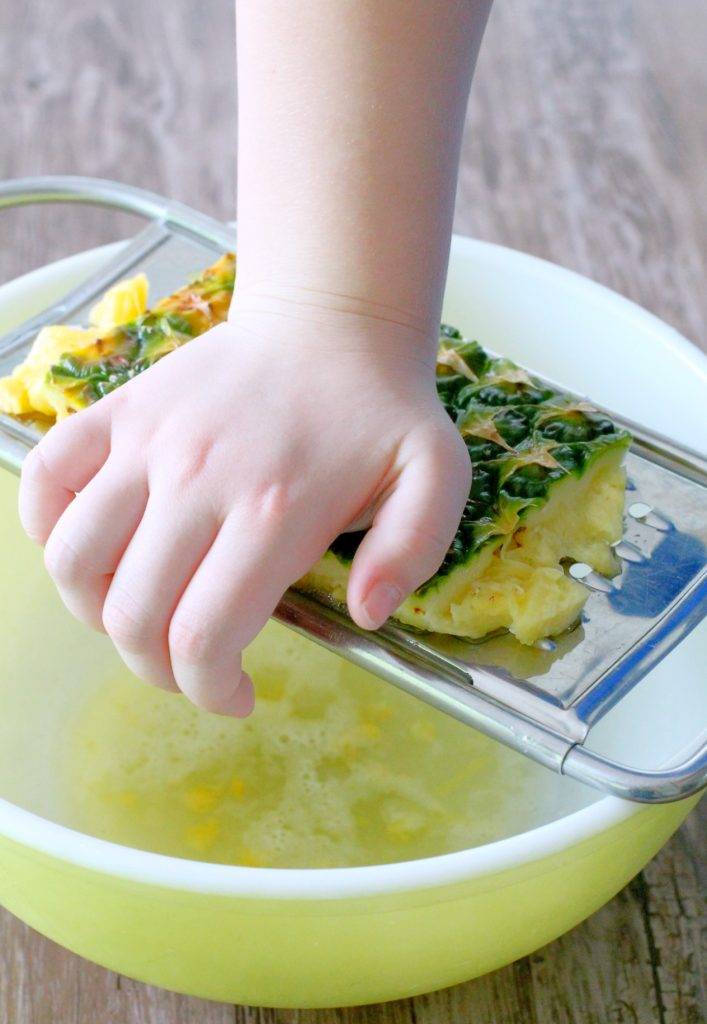 juicing a pineapple with a cheese grater