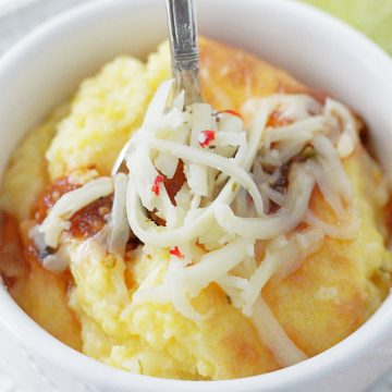 pepper jack cheese grits in bowl with spoon