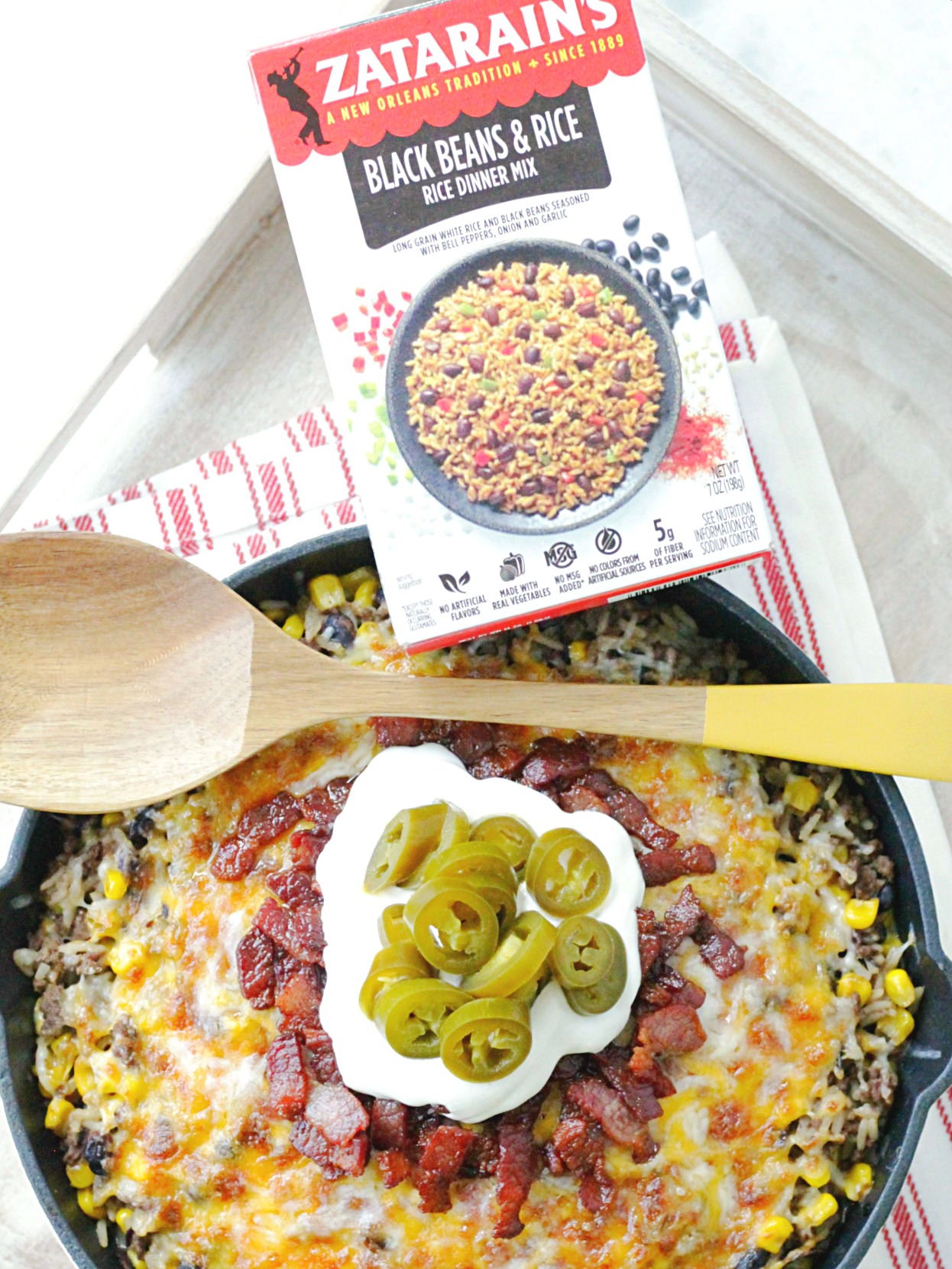 one skillet cowboy rice in skillet pictured with box of rice