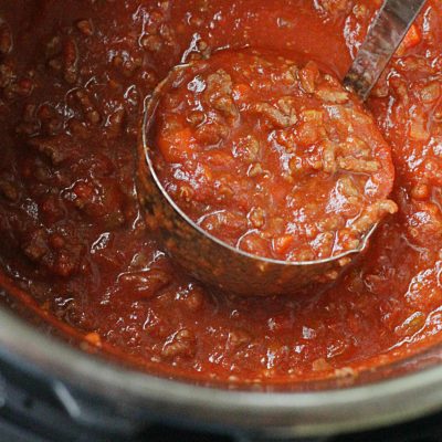 instant pot beef bolognese pasta sauce in ladle