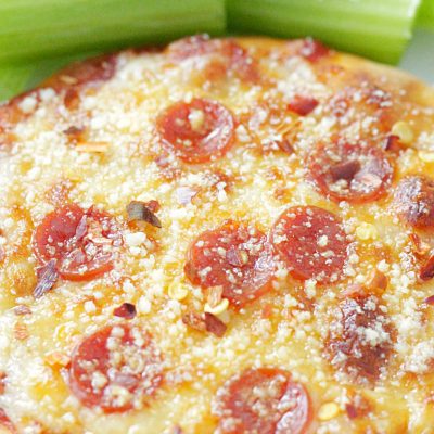perfect personal pizza on a plate with celery