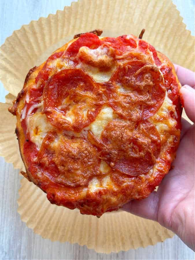 air fryer pizza fresh out of the air fryer basket