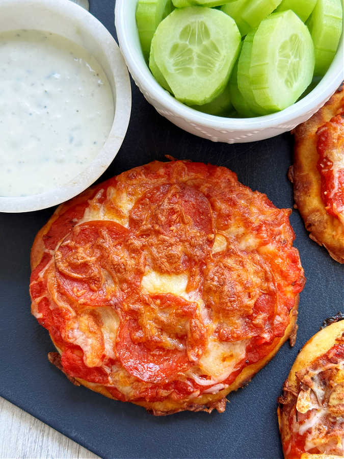 air fryer pizza with fresh veggies and dip on the side