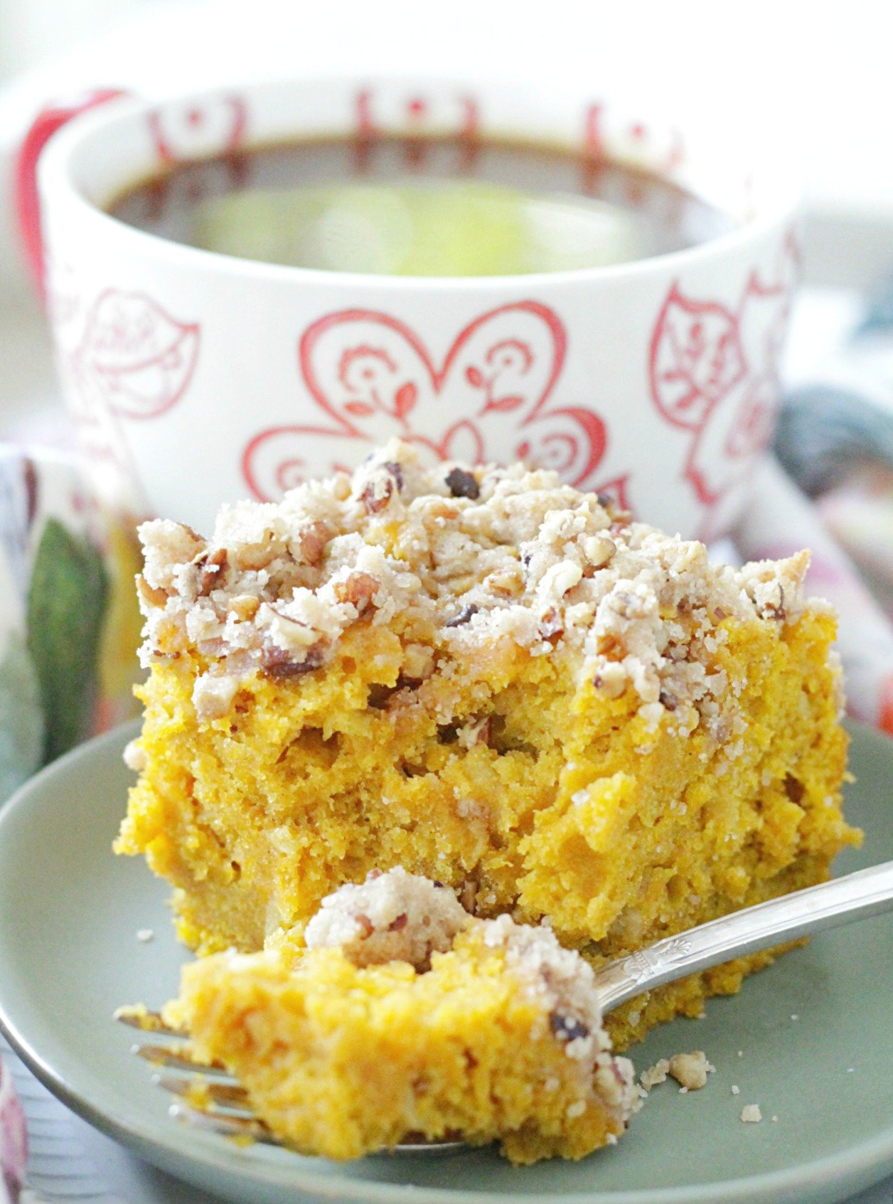 piece of pumpkin apple coffee cake with bite taken