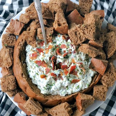 bacon party dip in a bread bowl overhead view