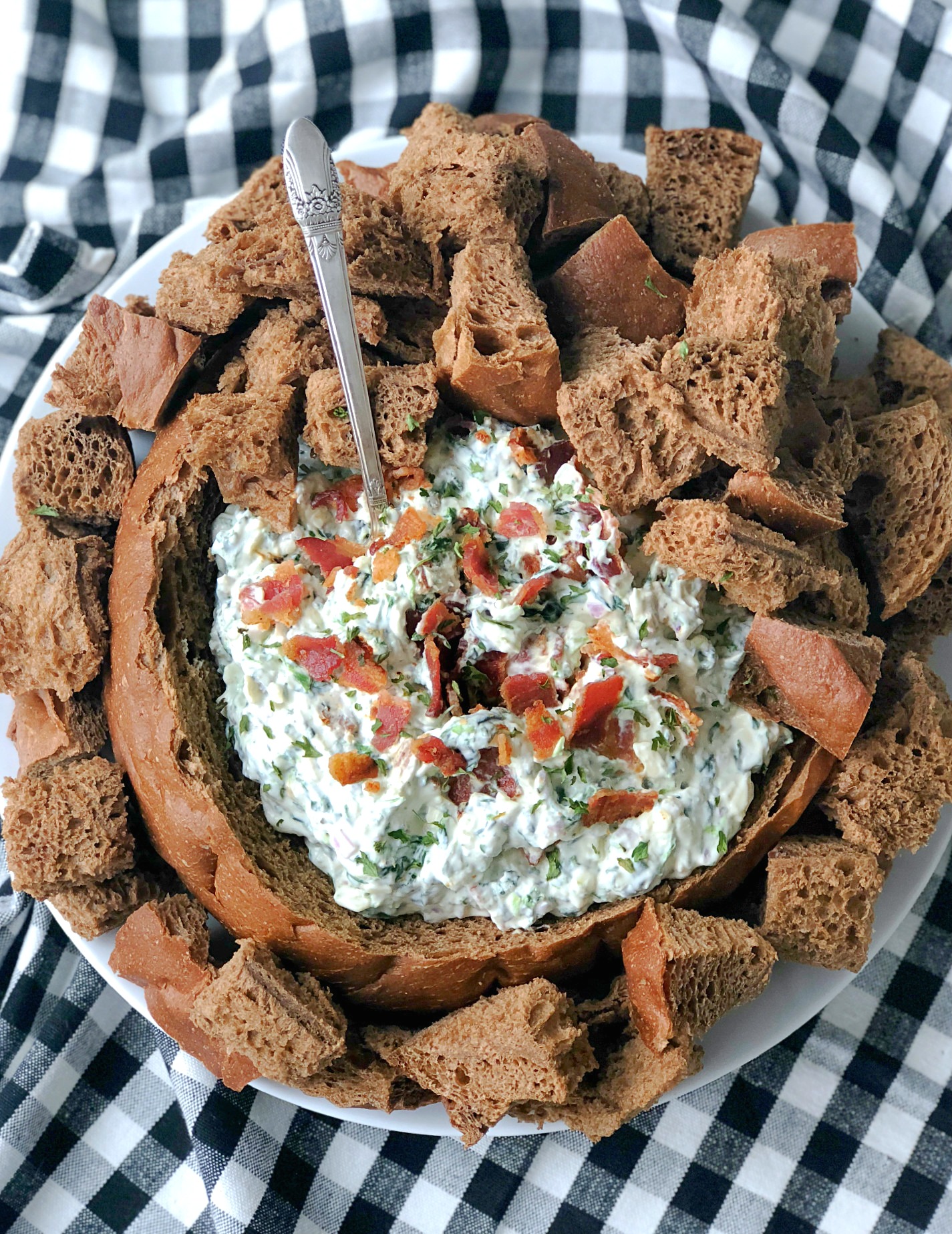 bacon party dip in a bread bowl overhead view