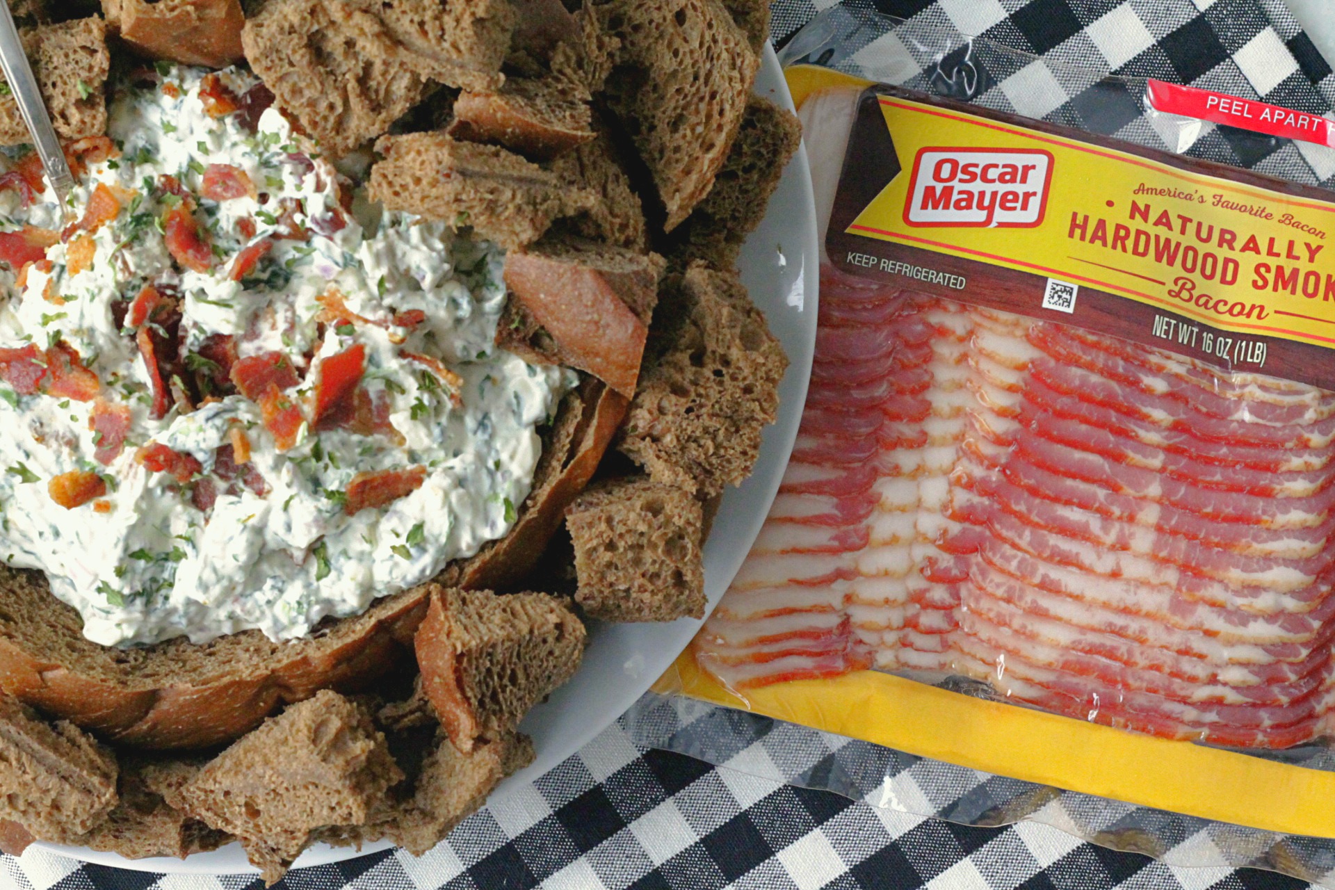 bacon party dip in a bread bowl with package of oscar mayer bacon