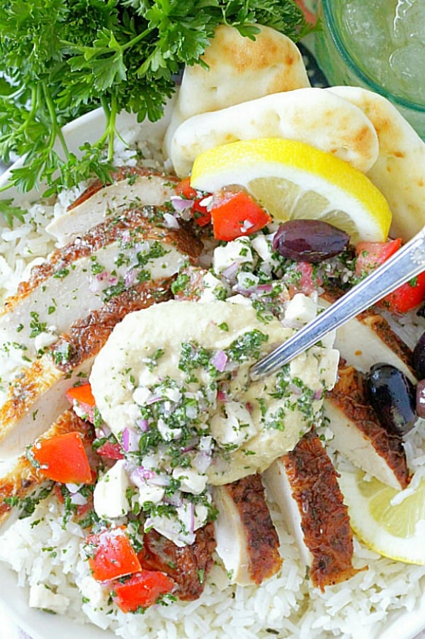 overhead view of greek chicken rice bowls