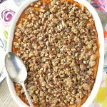 sweet potato pumpkin casserole in dish with spoon