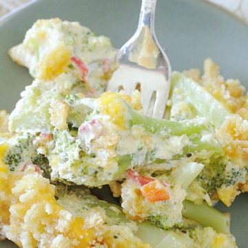 cheesy pimento broccoli casserole on plate with fork