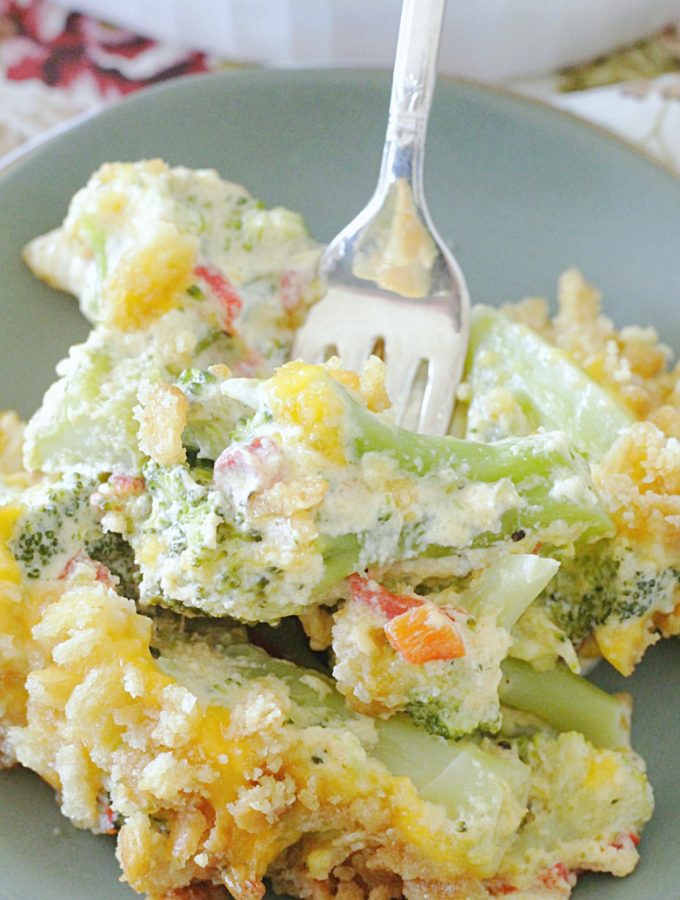 cheesy pimento broccoli casserole on plate with fork
