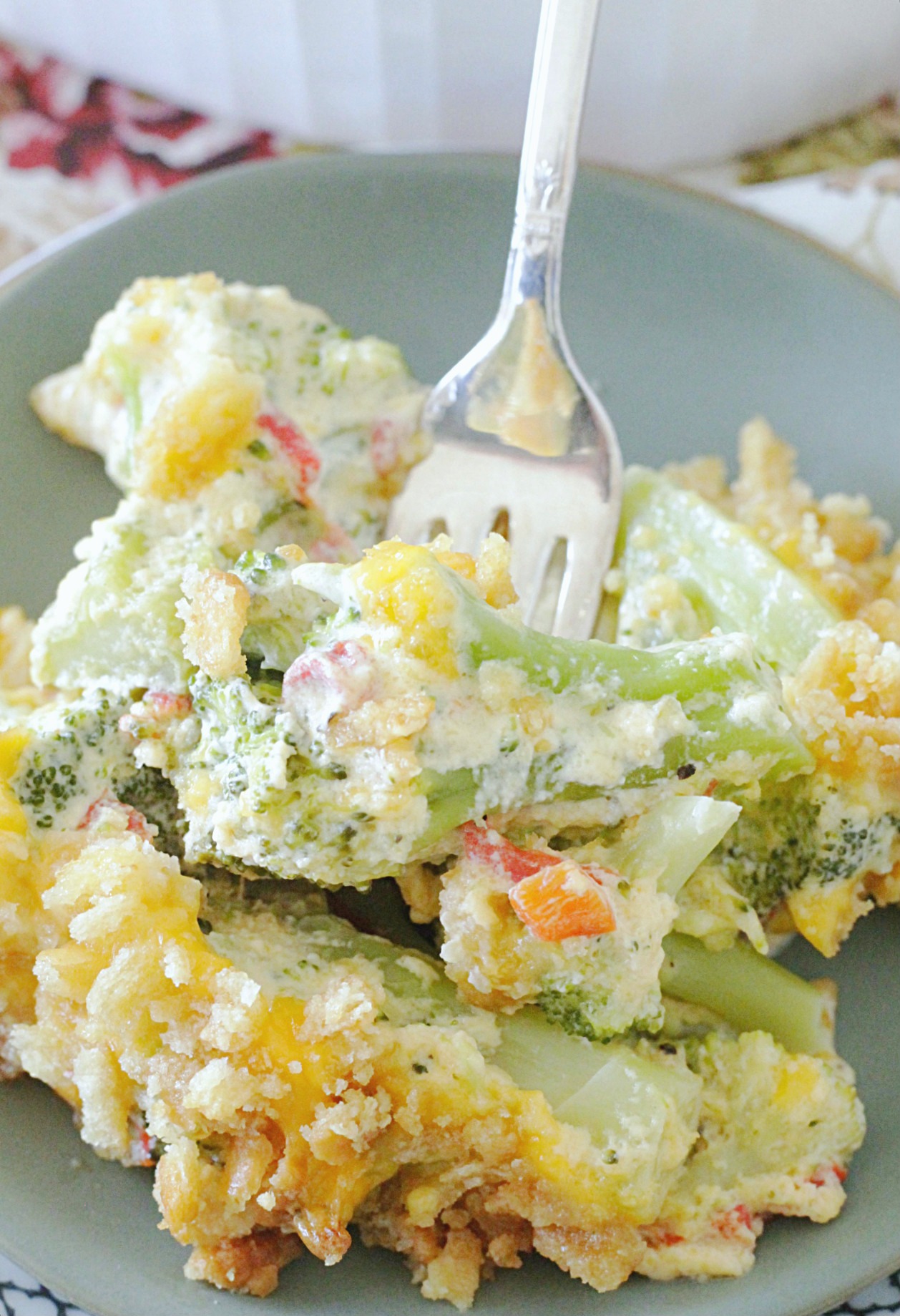cheesy pimento broccoli casserole on plate with fork