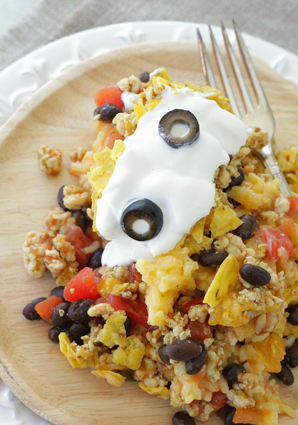 cheesy mexican rice casserole on plate with fork