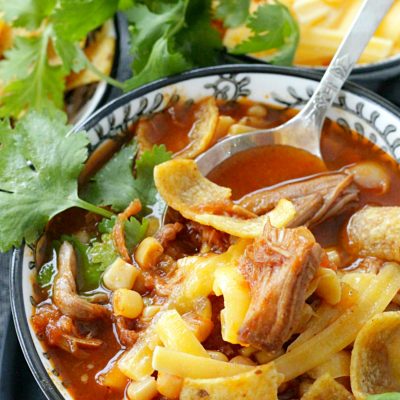 slow pulled pork chili in bowl with spoon