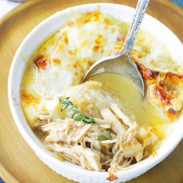 taking a bite of french onion chicken soup