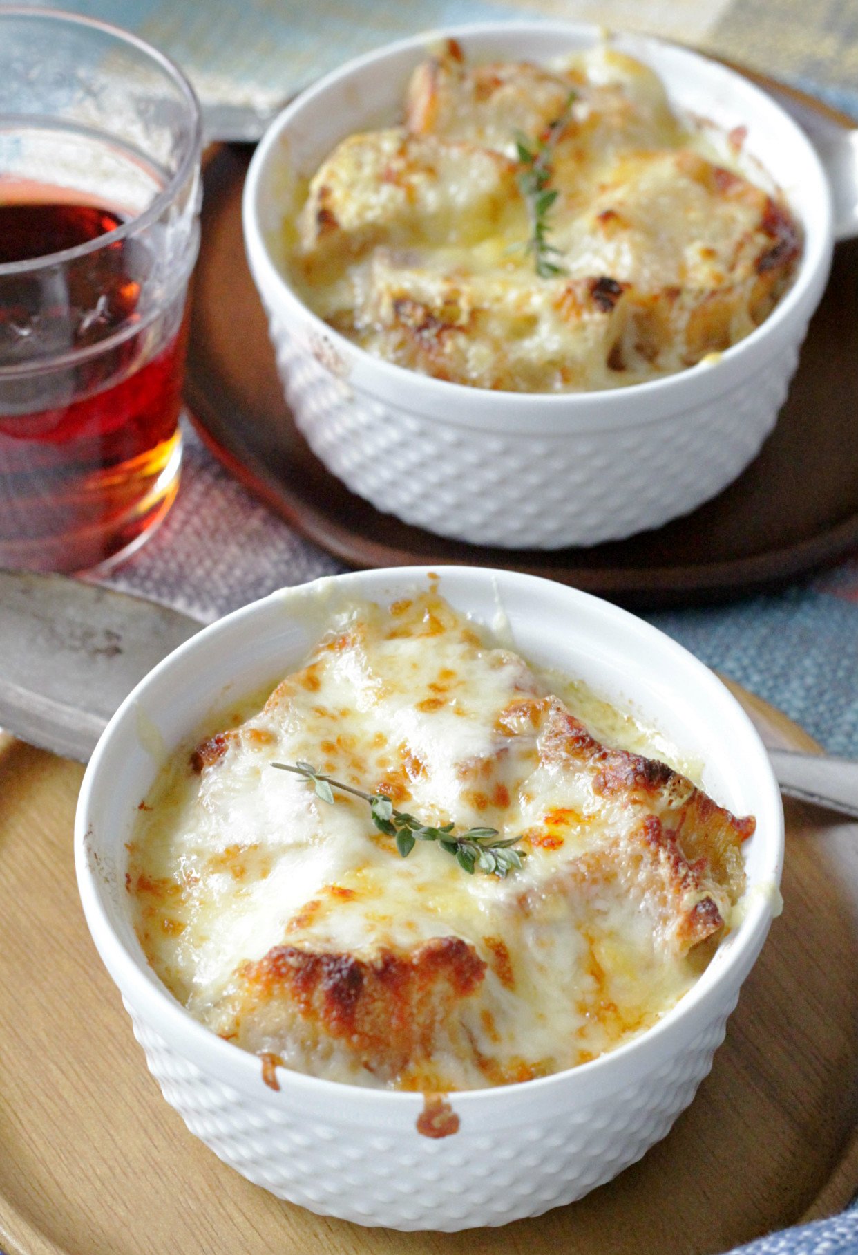 french onion chicken soup side view with two bowls