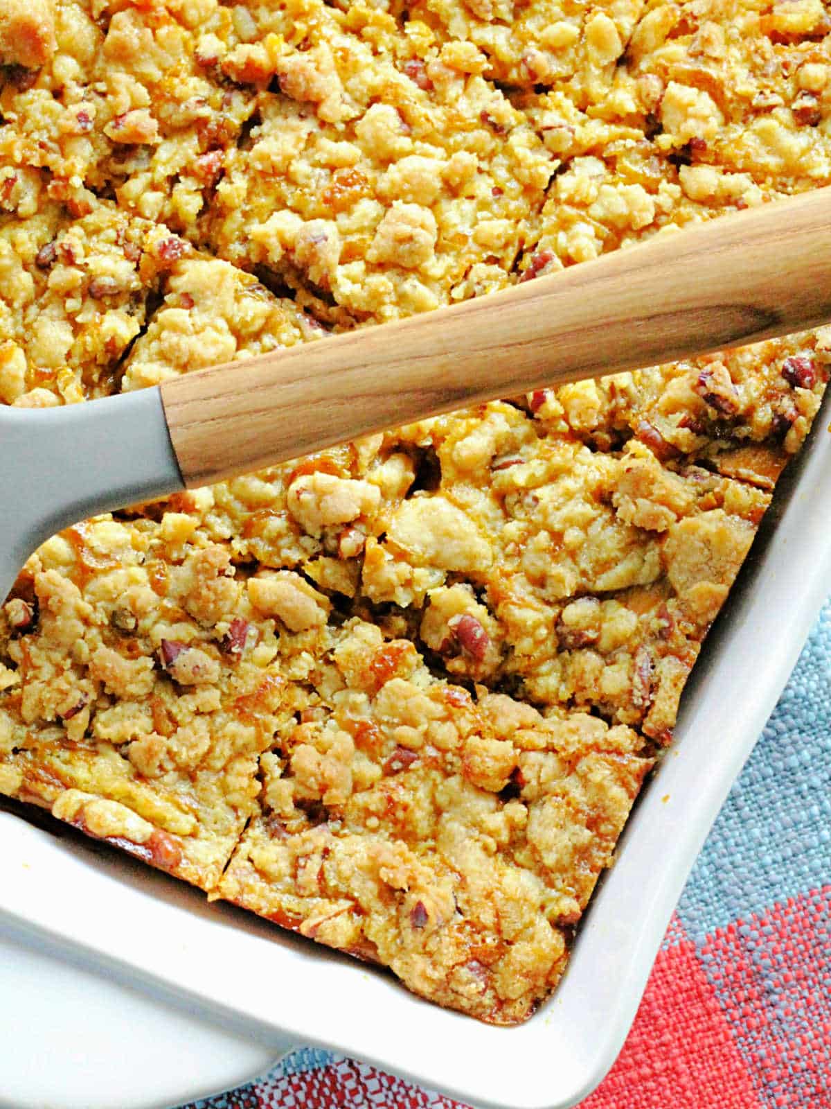 sliced pumpkin pie dump cake in the pan
