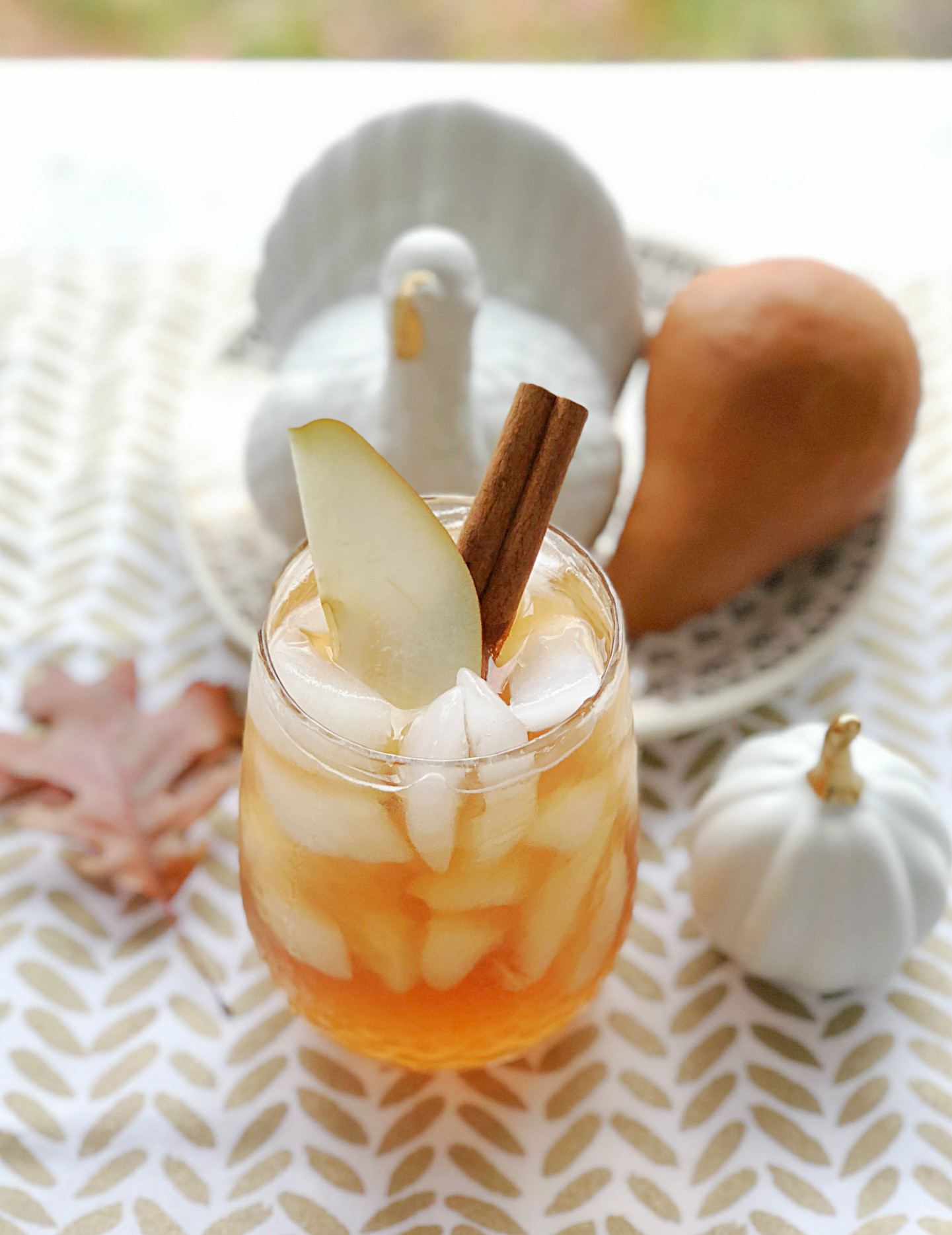 spiced pear tea fizz on table with ceramic turkey