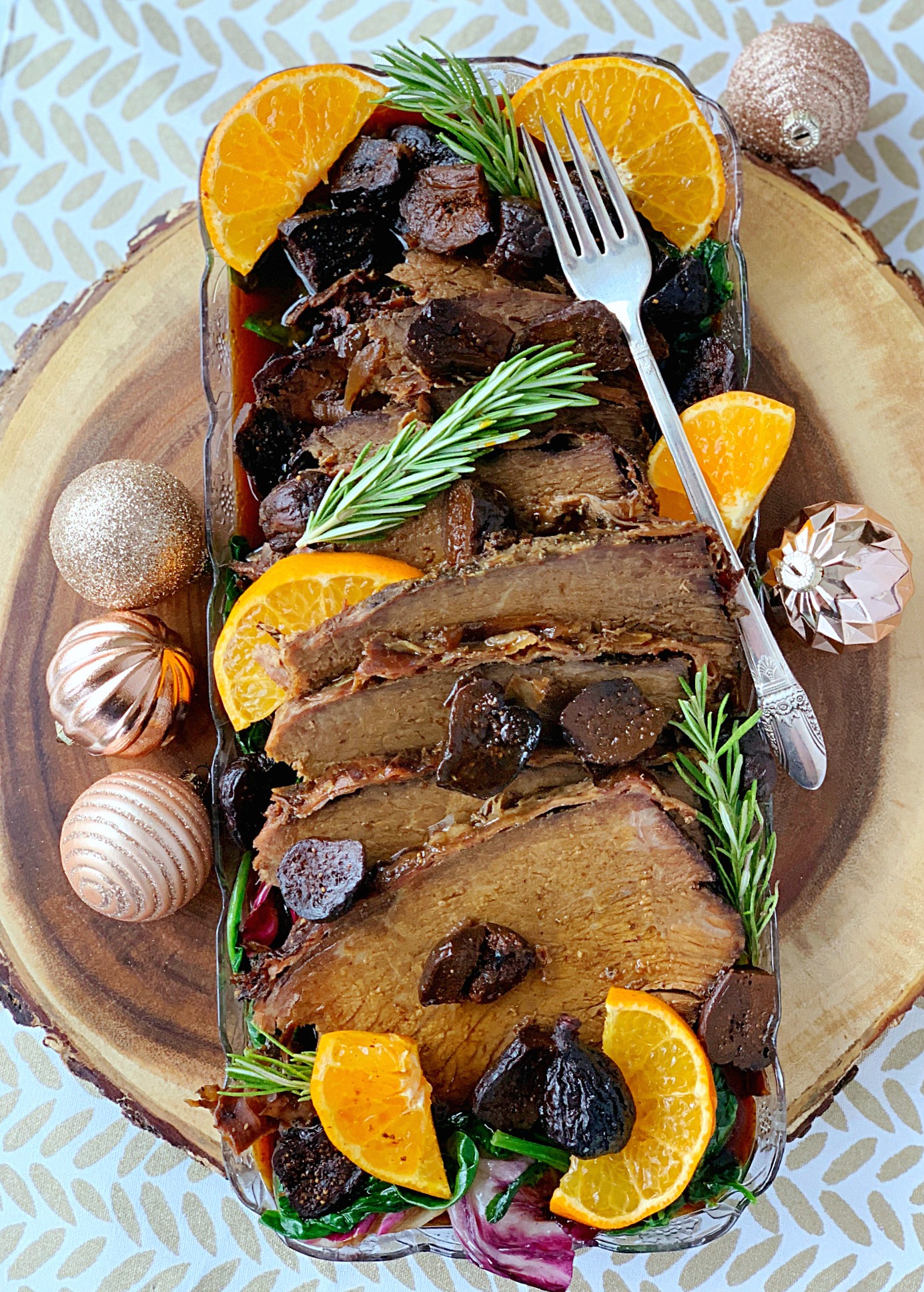 slow cooker rump roast with prosciutto and figs overhead view on platter