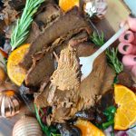 slow cooker rump roast with prosciutto and figs close up of beef on fork