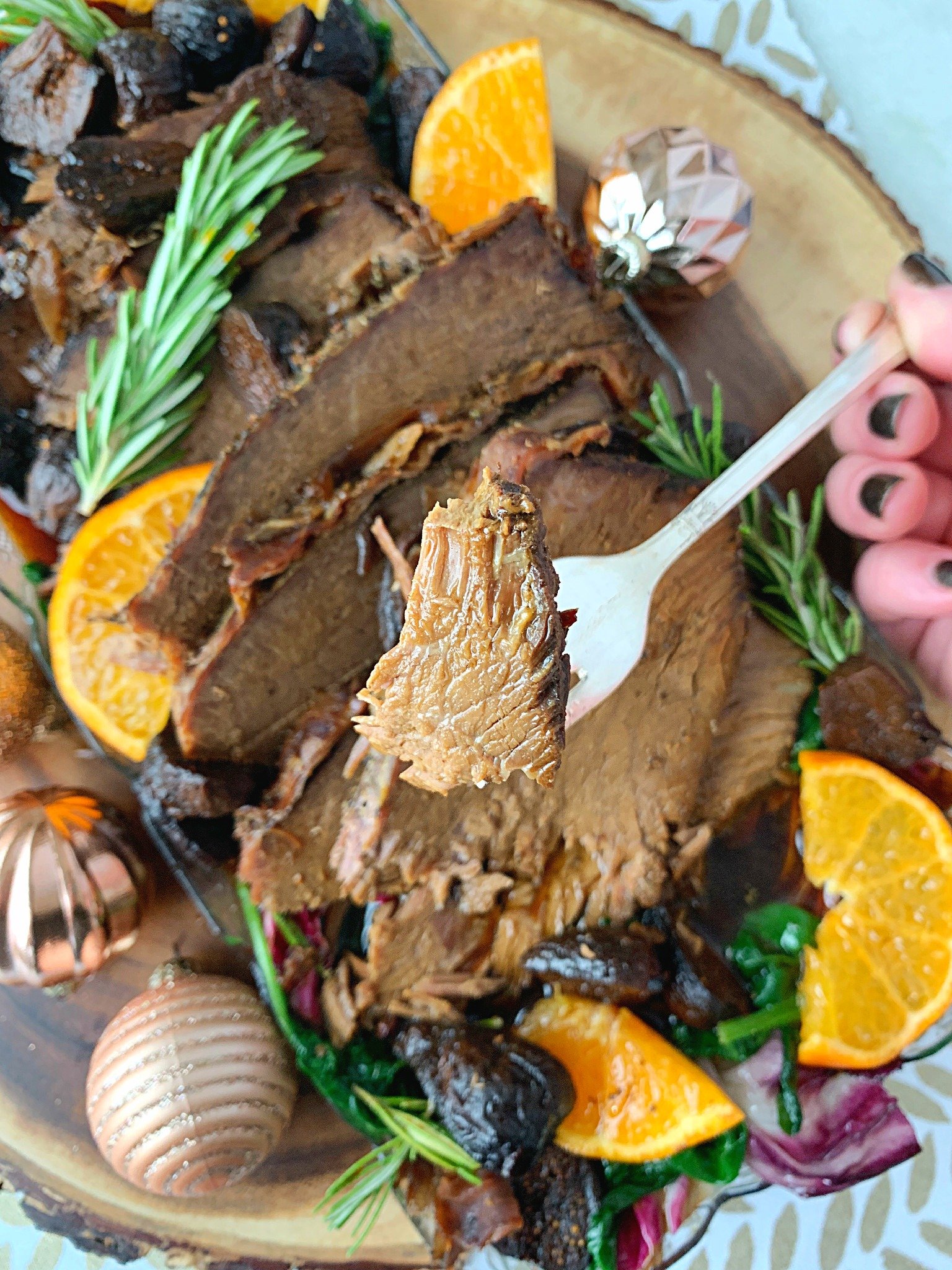 slow cooker rump roast with prosciutto and figs close up of beef on fork