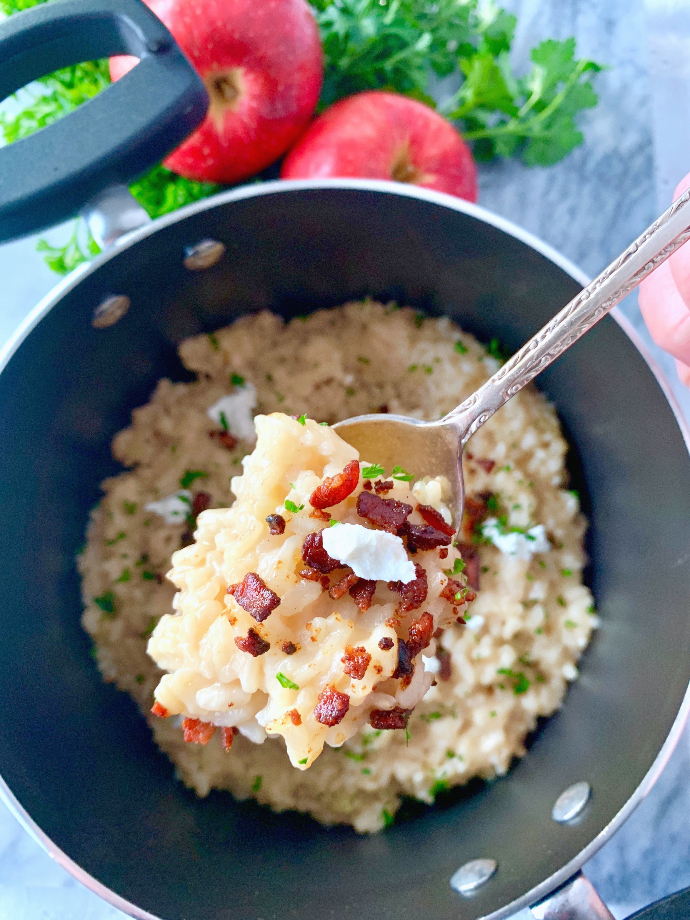 bacon apple risotto with goat cheese close up of risotto on spoon