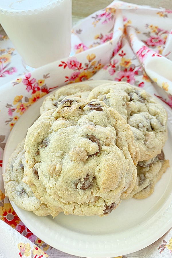 plate of chocolate and peanut butter chip cookies with glass of milk