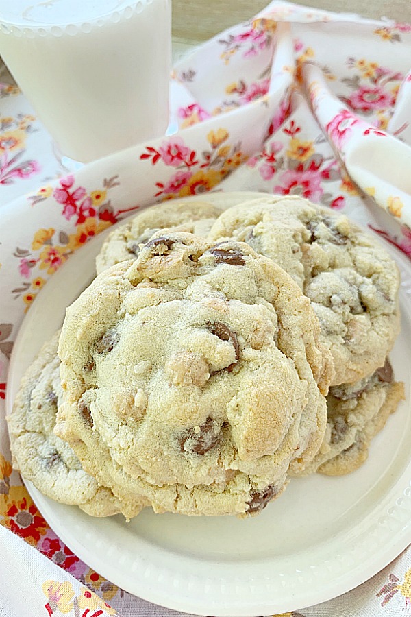 plate of chocolate and peanut butter chip cookies with glass of milk