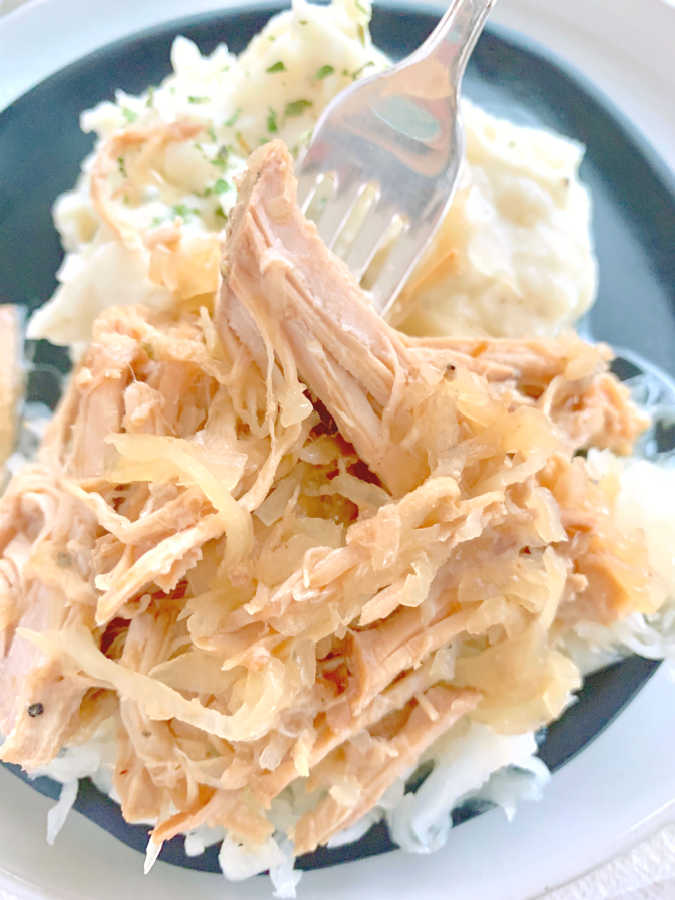 slow cooker pork and sauerkraut on a plate