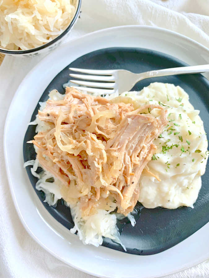 slow cooker pork and sauerkraut with mashed potatoes