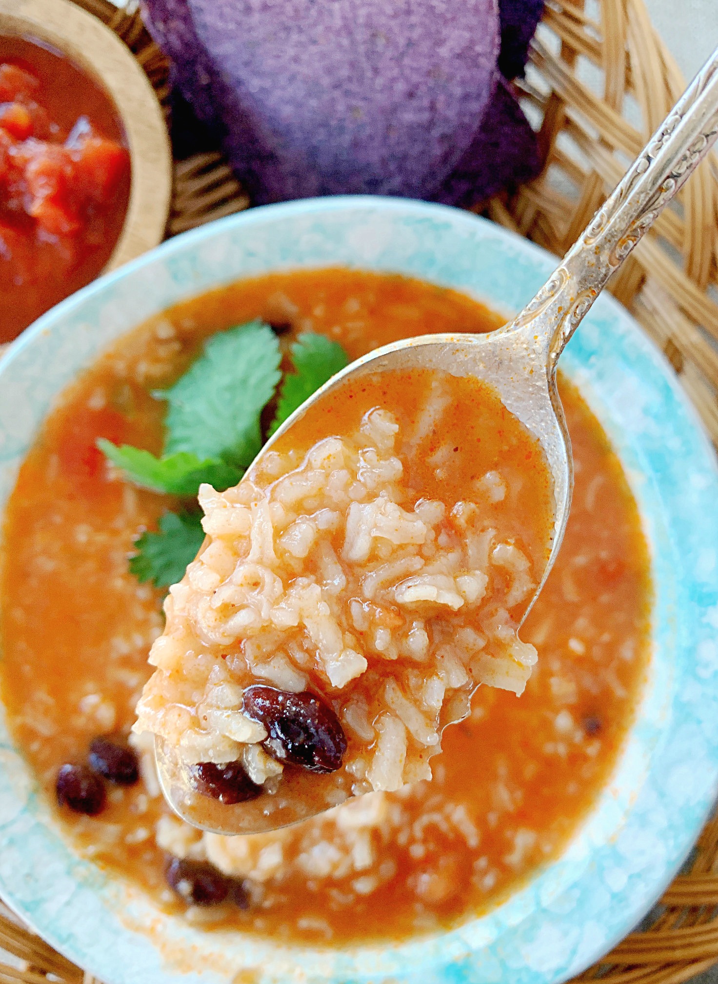 mexican rice and bean soup in a bowl with a spoon