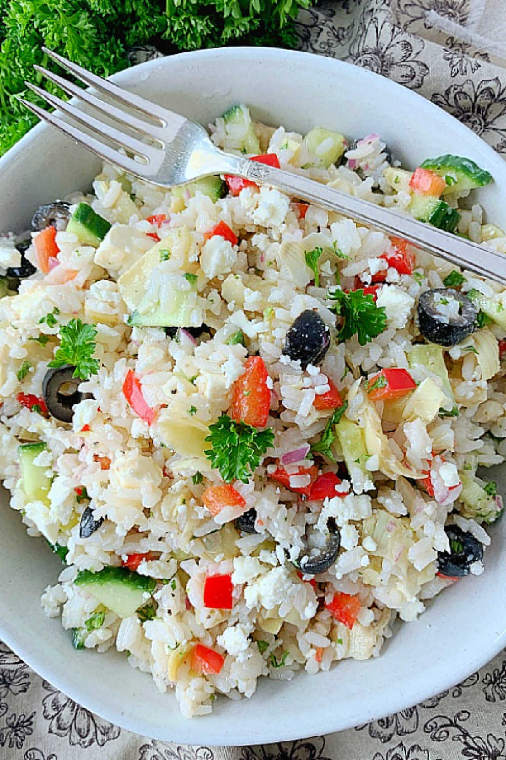 Greek Rice Salad starts with perfectly cooked rice and just might become your new favorite salad. It's also a gluten-free option to serve instead of pasta salad. via @foodtasticmom