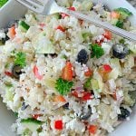 overhead view of greek rice salad in bowl