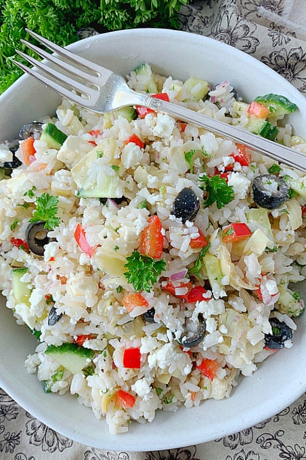 overhead view of greek rice salad in bowl