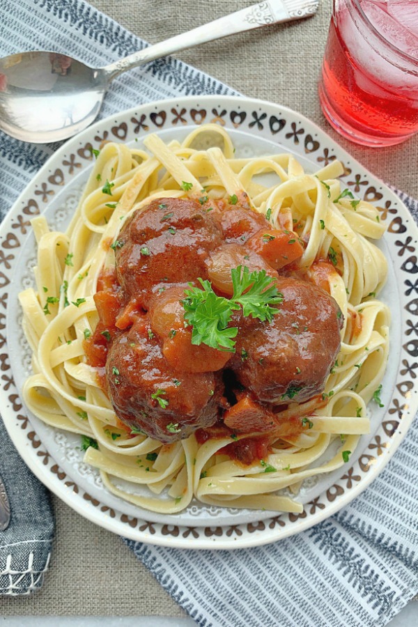 beef bourguinon meatballs on a plate of pasta