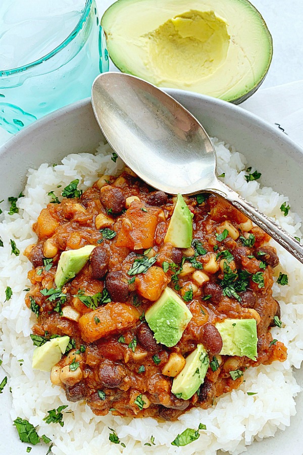 overhead view of vegetarian chili in bowl with spoon