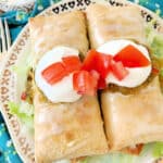 two plated air fryer chicken chimichangas