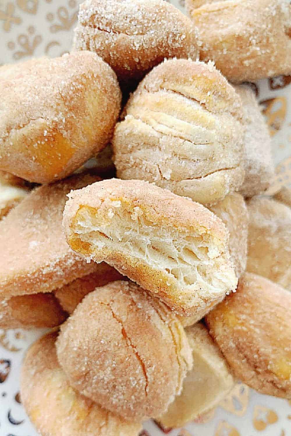 Satisfy your sweet tooth with these incredibly easy air fryer donut bites! Made from simple refrigerated biscuit dough and coated in a irresistible cinnamon sugar mix, these homemade donut holes are golden, fluffy and lightly crispy on the outside in under 10 minutes. via @foodtasticmom