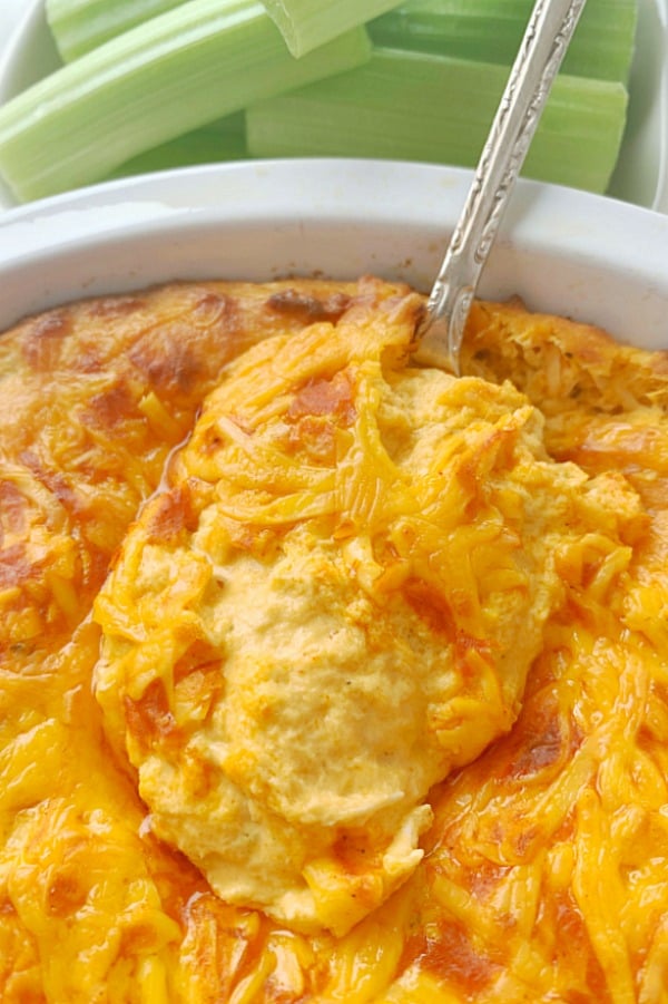 close up of spoon in dish of buffalo chicken dip
