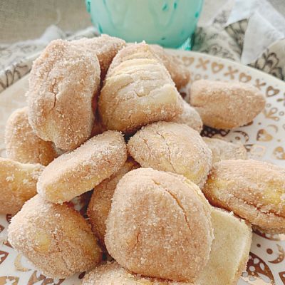 air fryer donut bites on plate with glass of milk