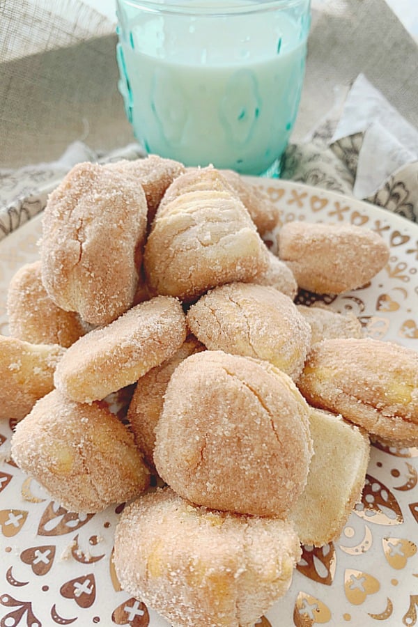 air fryer donut bites on plate with glass of milk