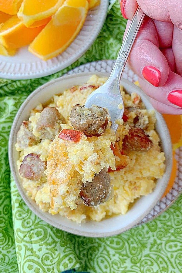 forkful of loaded grits breakfast casserole